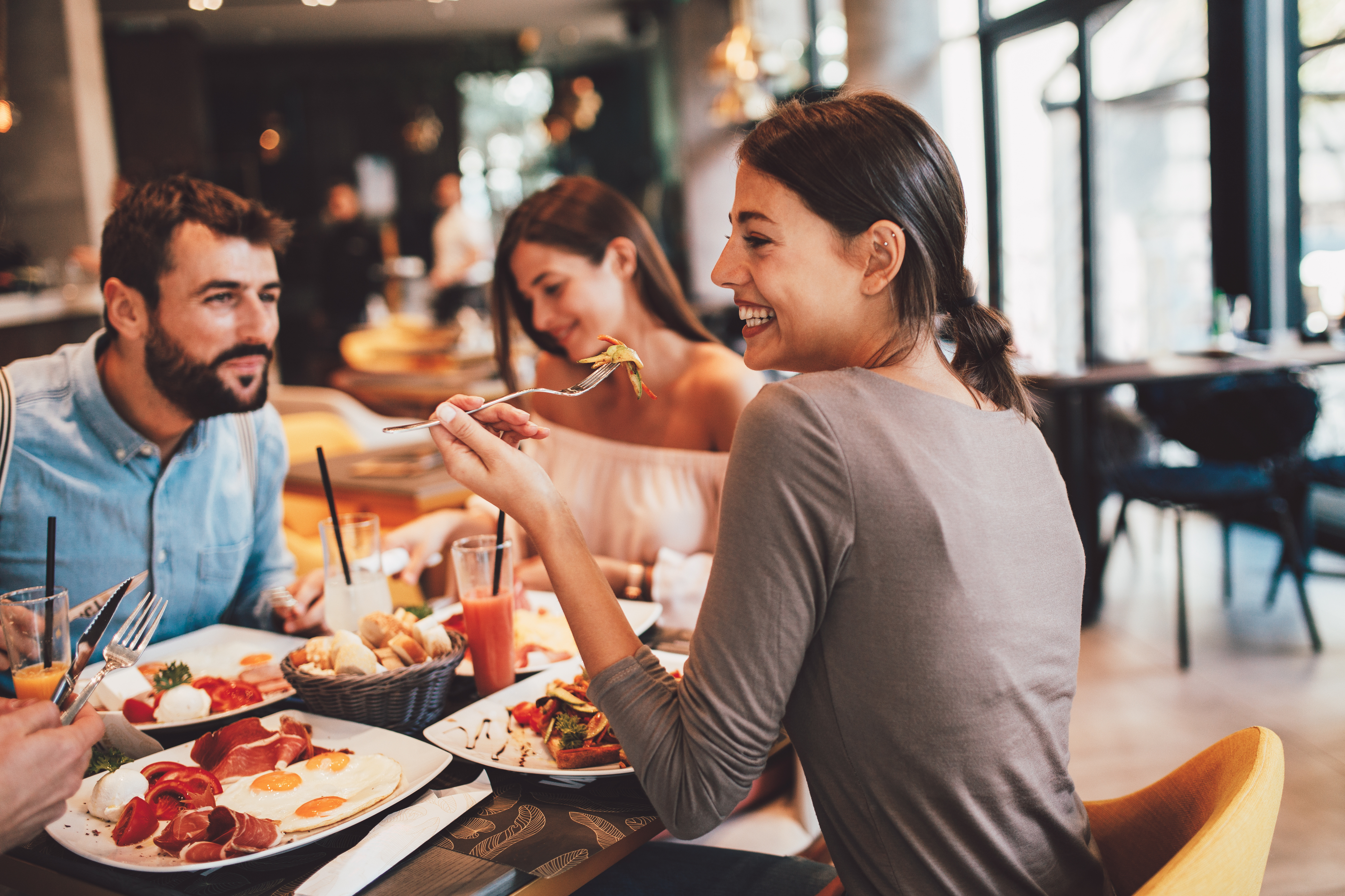Restaurant owner serving customers